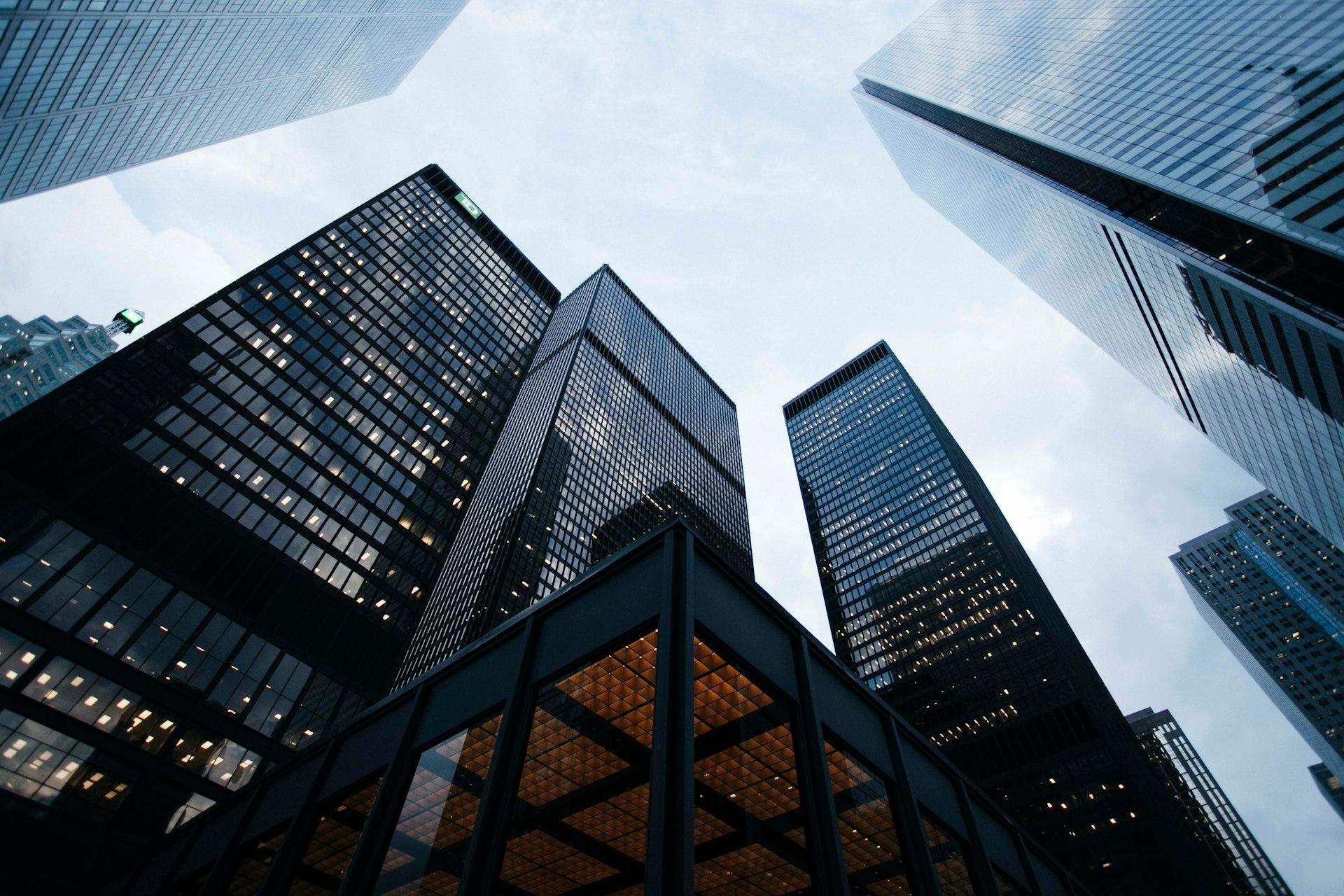 Glass office towers seen looking up from street level